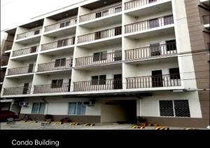 an apartment building with balconies on the side of it at Condo Stay at Paranaque with Unlimited WIFI v3 in Manila