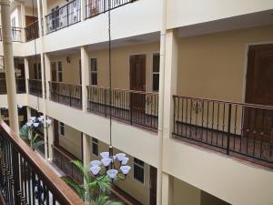 a view of the balconies of a building at 101 Suites in Paramaribo