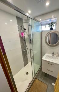 a bathroom with a shower and a sink at Coockooning Led in Basse-Yutz