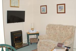 TV a/nebo společenská místnost v ubytování Haven Cosy Cottage