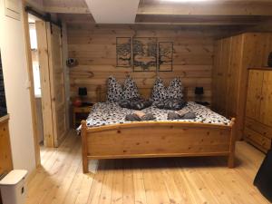 a bedroom with a bed with pillows on it at Zelený ostroff Treehouse in Jiříkov