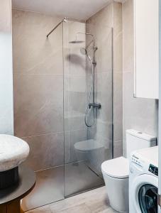 a shower with a glass door in a bathroom at Sapphire Riviera Residence in Adeje