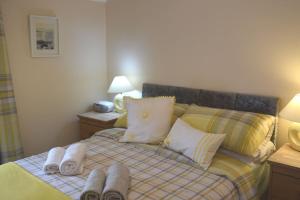 Кровать или кровати в номере Hill View Cottage