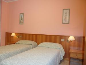 Postel nebo postele na pokoji v ubytování Hotel Ristorante Al Bassanello
