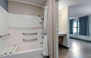 a bathroom with a bath tub and a sink at Extended Stay America Suites - Fremont - Newark in Fremont +29 photos