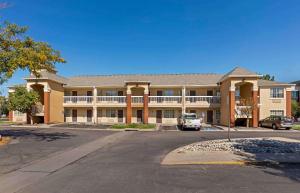 an empty parking lot in front of a building at Extended Stay America Select Suites - Denver - Aurora South in Aurora