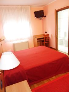 Postel nebo postele na pokoji v ubytování Hotel Ristorante Al Bassanello