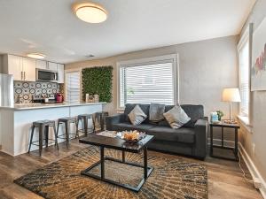a living room with a couch and a table at Heart of Westport 1BR in Kansas City