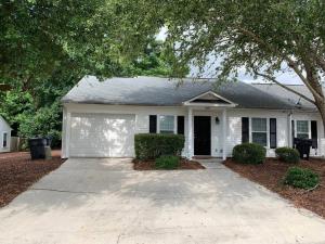 a white house with a driveway in front of it at Comfy, Stylish Townhome Near I-20! in Augusta