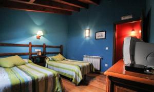 A bed or beds in a room at La Quintana Sinariega