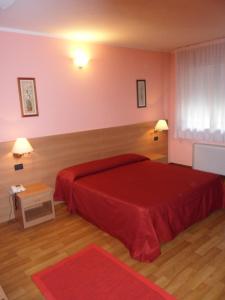 Postel nebo postele na pokoji v ubytování Hotel Ristorante Al Bassanello