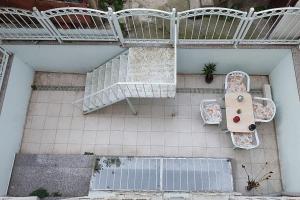 an overhead view of a table and chairs on a tile floor at Cozy 1+1 and garden, in center of İstanbul in Istanbul