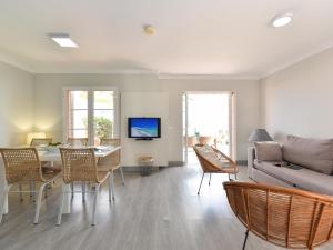 a living room with a couch and a table at Fantastic holiday home in Playa del Ingles a few meters from the beach in Playa del Ingles