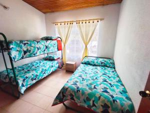 Postel nebo postele na pokoji v ubytování Condominio El Portal Casa 5