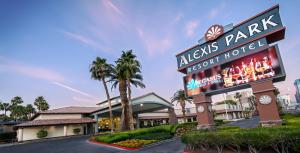 a sign for the alvis park resort hotel at Alexis Park All Suite Resort in Las Vegas