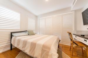 A bed or beds in a room at Sandcastle