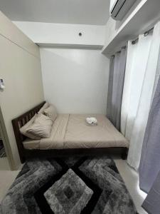 Tempat tidur dalam kamar di Stylish 1BR Condo @ SM Southmall
