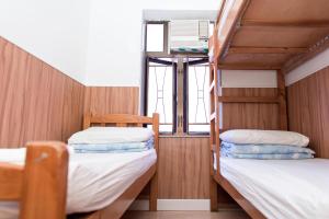 Katil atau katil-katil dalam bilik di Ah Shan Hostel