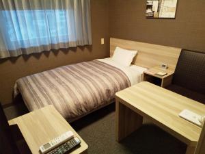 Hotel Route-Inn Dai-ni Nishinasuno客房内的一张或多张床位