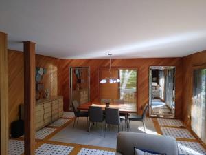 a dining room with a table and chairs at Cozy Chalet in Sainte-Adèle