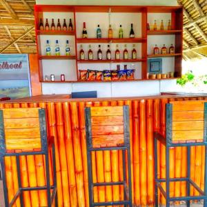 a bar with two stools in front of it at WJV BEACH RESORT MOALBOAL in Cebu City +22 photos