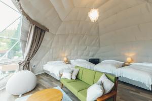 Krevet ili kreveti u jedinici u okviru objekta LUONTE 霧の高原 Glamping