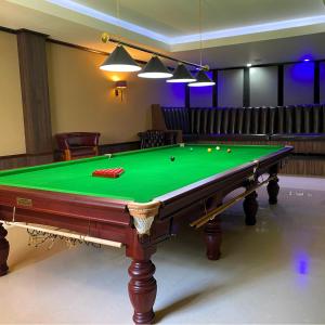 a room with a pool table with balls on it at The Pleasure Dome in Amed
