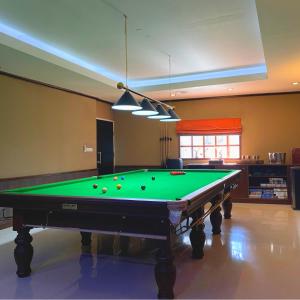 a living room with a pool table in a room at The Pleasure Dome in Amed +36 photos