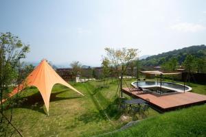 a large kite sitting on top of a yard at Marinetopia The Suite in Miyazu