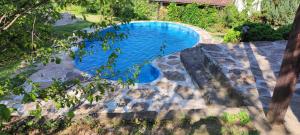 an overhead view of a swimming pool in a yard at "Суларската къща" in Gabrovo