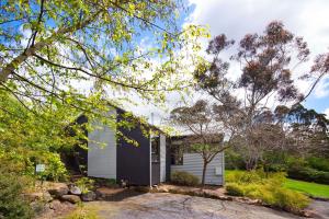 a house with a black and white exterior at Daylesford Spa Villa 6 in Daylesford