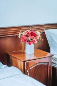 Postel nebo postele na pokoji v ubytování Cherry Hotel