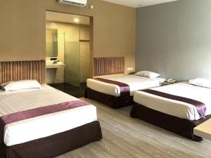 Letto o letti in una camera di Hotel Sinar 1