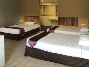 Letto o letti in una camera di Hotel Sinar 1