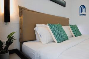 Homi Oasis at KK Times Square 和逸绿洲客房内的一张或多张床位