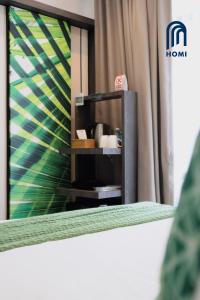 Homi Oasis at KK Times Square 和逸绿洲客房内的一张或多张床位