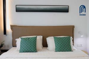 Homi Oasis at KK Times Square 和逸绿洲客房内的一张或多张床位