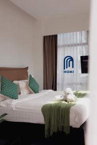 Homi Oasis at KK Times Square 和逸绿洲客房内的一张或多张床位