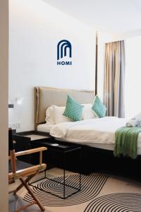 Homi Oasis at KK Times Square 和逸绿洲客房内的一张或多张床位