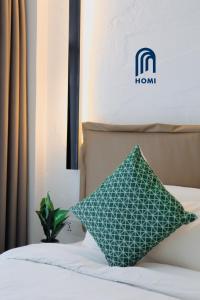 Homi Oasis at KK Times Square 和逸绿洲客房内的一张或多张床位