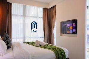 Homi Oasis at KK Times Square 和逸绿洲客房内的一张或多张床位