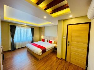 Ένα ή περισσότερα κρεβάτια σε δωμάτιο στο Hotel Aerocity