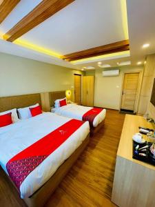 Ένα ή περισσότερα κρεβάτια σε δωμάτιο στο Hotel Aerocity