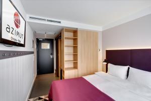 Łóżko lub łóżka w pokoju w obiekcie AZIMUT Hotel Ufa