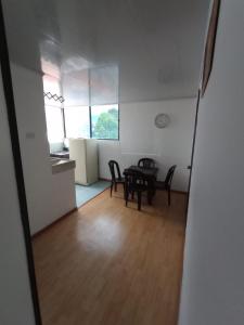 a dining room and kitchen with a table and chairs at Cerca al club militar embajada americana, Corferias 502 in Bogotá