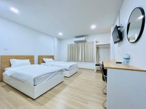 Postel nebo postele na pokoji v ubytování PD Apartment Inn