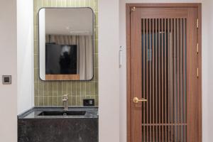 a bathroom with a sink and a mirror at Simjak Hotel by Anook in Hwaseong +90 photos