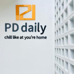 a logo for pd daily chill like at youre home at PD Apartment Inn in Ban Pra Dok