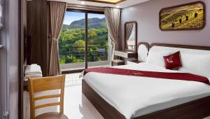 Postel nebo postele na pokoji v ubytování En Hotel Sapa