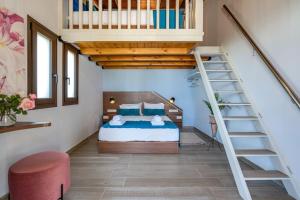 a bedroom with a bed and a spiral staircase at Rena's Rustic retreat in Chania Town